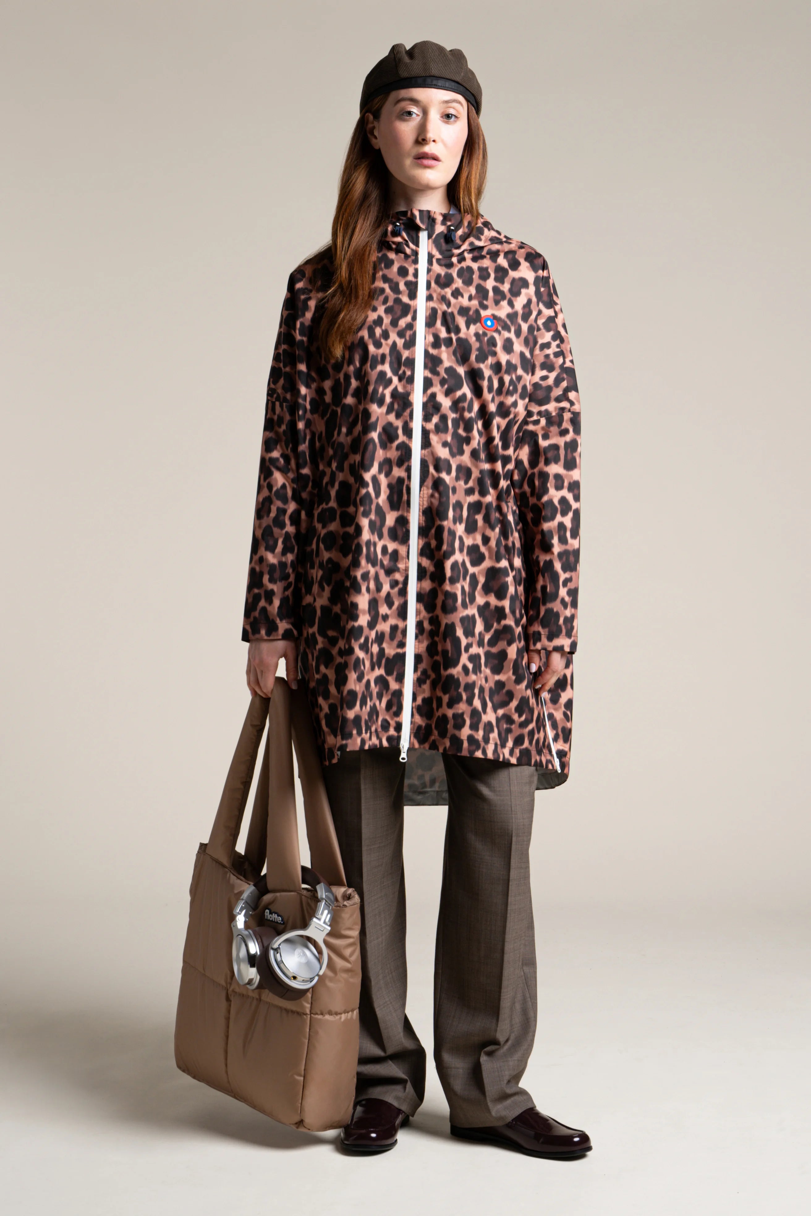 Liberté - Cape de pluie - Veste coupe-vent modulable en sac - Flotte - couleur new leopard #couleur_new-leopard